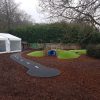 Playground in-ground mound tunnel play area view