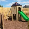 Wide view of Playground Tower with slide in a school play area