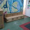 Mars Montessori timber storage bench beside play area