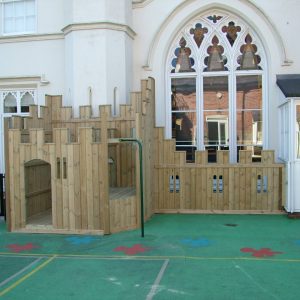 Old Vicarage compact timber adventure play fort with scramble net firepole and coloured wet-pour surfacing