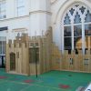 Old Vicarage side view showing timber fort and crenelated play screen