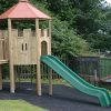 Front view of roofed Playground Lookout with green slide