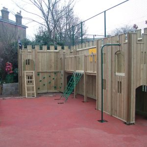 St Christopher's linked timber adventure play structure with raised walkway scramble net and firepole