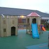 Sunbeam Nursery gatehouse and climbing den linked by bridge with open slide