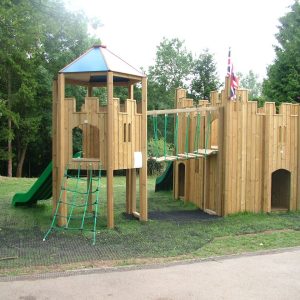 Woodchester School double adventure play with linked castle climbing den slides and net bridge