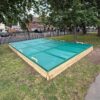 Bespoke 7x4m timber sandpit with sectional covers