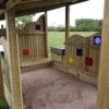 Bespoke covered sandpit detail view with timber panels