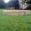 Jumbo hex sandpit low front view with slatted cover