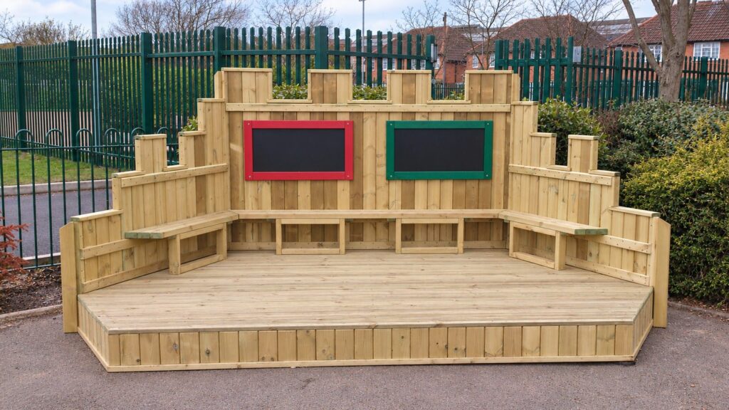 Open timber performance stage with two chalkboards and built-in benches