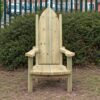 High-backed timber storytelling chair with armrests beside a hedge