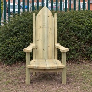 High-backed timber storytelling chair with armrests beside a hedge