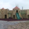 Gypsy Wood timber play towers with slide and rubber mulch surfacing