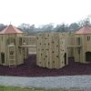 Gypsy Wood timber play structure with climbing panels and linked towers