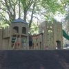 Front view of the Merlewood timber play fort and slide
