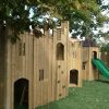 Oakdale timber castle structure with slide