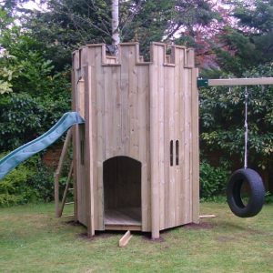 Garden play turret with slide and swing attachment