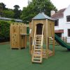 St Brelades timber turret with open slide climbing wall and ladder