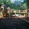 The Downs timber towers connected by bridge routes in a wooded play area