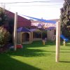 Shade sail canopy over an outdoor playground area