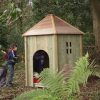 Jungle Huts timber playground den in a woodland setting