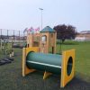 Playground above ground tunnel with timber play tower