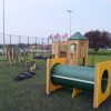 Playground above ground tunnel side view