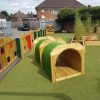 The Oval Primary School astro covered tunnel with rainbow fencing and sensory panels
