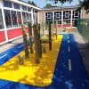 Four Acres Academy roadway markings and timber play frame on coloured wet-pour surfacing