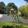Pembridge Square Garden landscaped garden play area with tower swings and safety surfacing