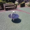 Pembridge Square Garden spinner and timber bench on safety surfacing