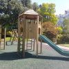 Pembridge Square Garden play tower with open slide in landscaped communal garden