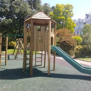 Pembridge Square Garden play tower with open slide in landscaped communal garden