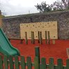 The Royal play panel tower slide and fenced rubber safety surfacing
