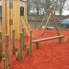 The Royal play tower slide balance features and rubber safety surfacing