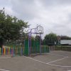 Side view of metal multi goals on a school playground court