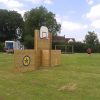 Wooden multi-use goal structure with football goal opening