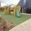 HPB Lucker Hall timber towers with open slide and green safety surfacing