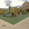HPB Lucker Hall double adventure play installation with timber towers, slide and green safety surfacing