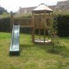 Garden lookout with bridge end panel, slide and climbing access