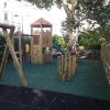 Princes Square Garden balance play features with tower and swings in communal garden