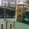Princes Square Garden play tower with open slide in landscaped garden setting