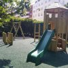 Princes Square Garden play tower with open slide and bonded rubber mulch surfacing