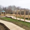 Lyppard Grange deck boardwalk with timber pergola and outdoor retreat