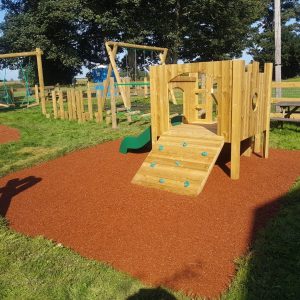Old Downs complete playground with toddler tower swing frames and bonded rubber mulch surfacing