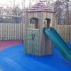 Commercial Flats Bristol play tower with open slide and coloured wet-pour surfacing