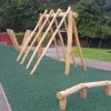Kings Stanley scramble pyramid with timber balance beam and green safety surfacing