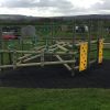 Installed clamber stack with timber logs and climbing panels