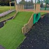 Bank tunnel entrance with timber sides and grass safety matting at Minchinhampton School