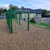 Activity play area with green play frame and bank tunnel at Minchinhampton School