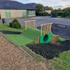 Bank tunnel with grass safety matting and timber retaining edges at Minchinhampton School